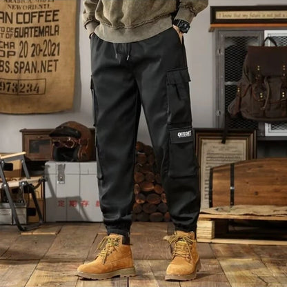 2025 New Men Casual Pants Autumn Multi Pocket Sports Pants Khaki Black Green Elastic Waist Pants M-4XL