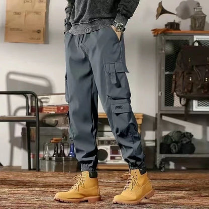 2025 New Men Casual Pants Autumn Multi Pocket Sports Pants Khaki Black Green Elastic Waist Pants M-4XL