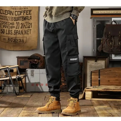 2025 New Men Casual Pants Autumn Multi Pocket Sports Pants Khaki Black Green Elastic Waist Pants M-4XL
